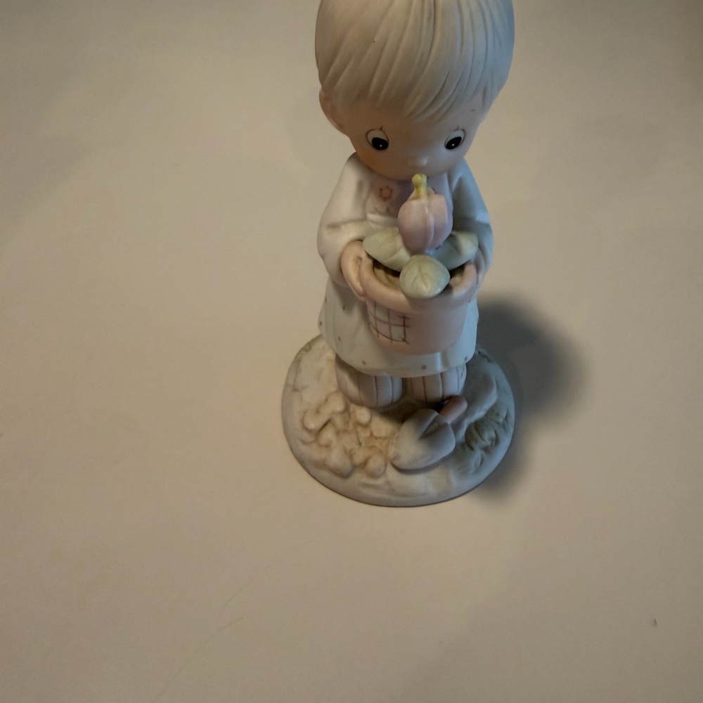 Precious Moments Precious Figurine girl holding a planter with flower and shovel